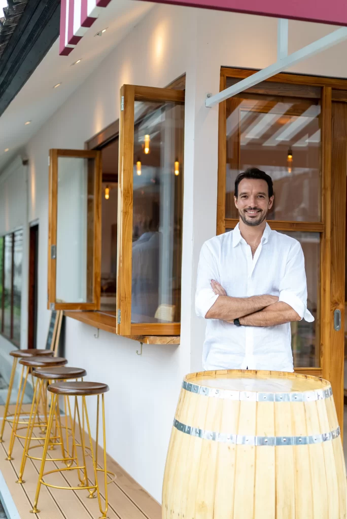 The owner of Belle standing outside