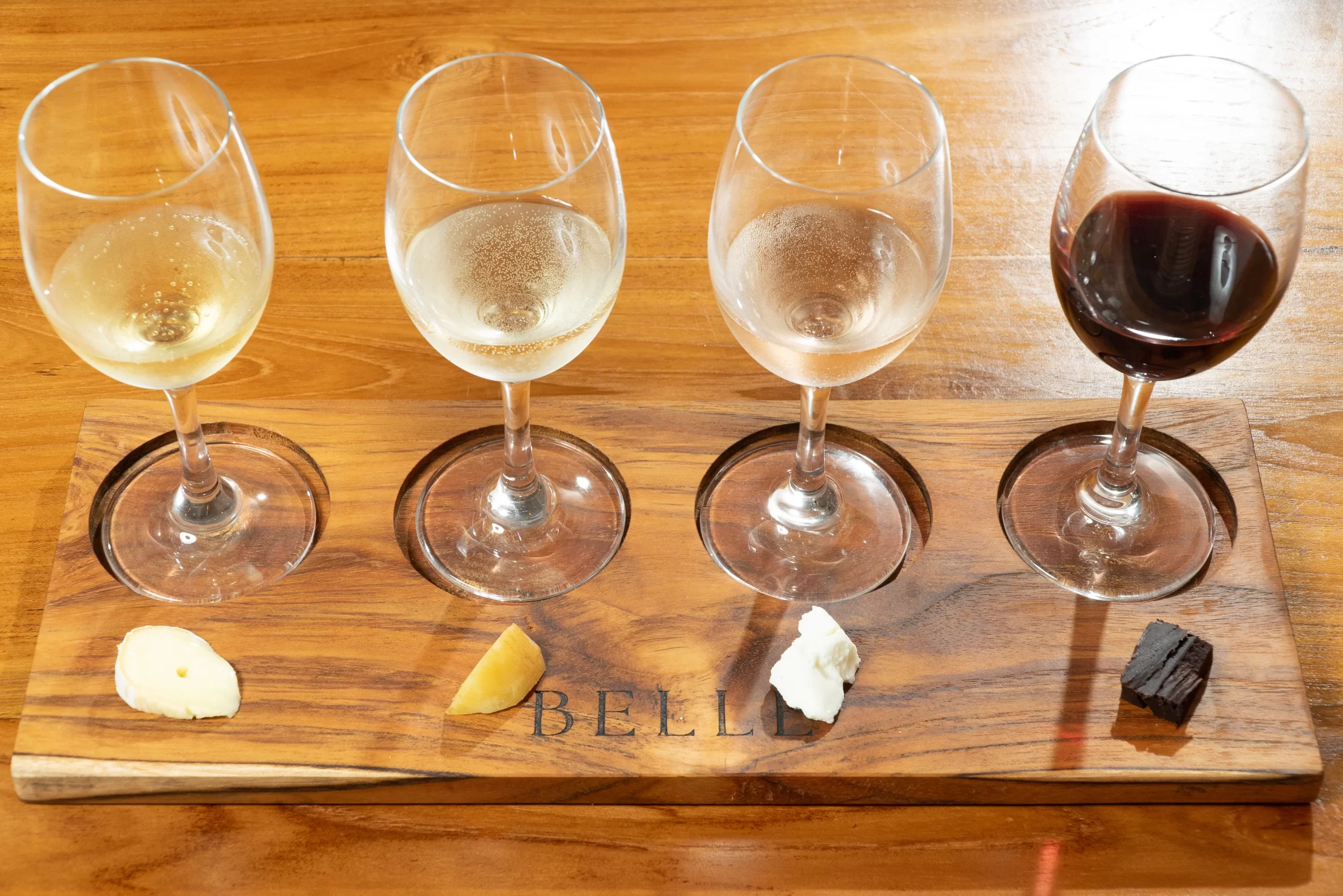 Four Glasses of Wine with Cheese And Chocolate Pairings
