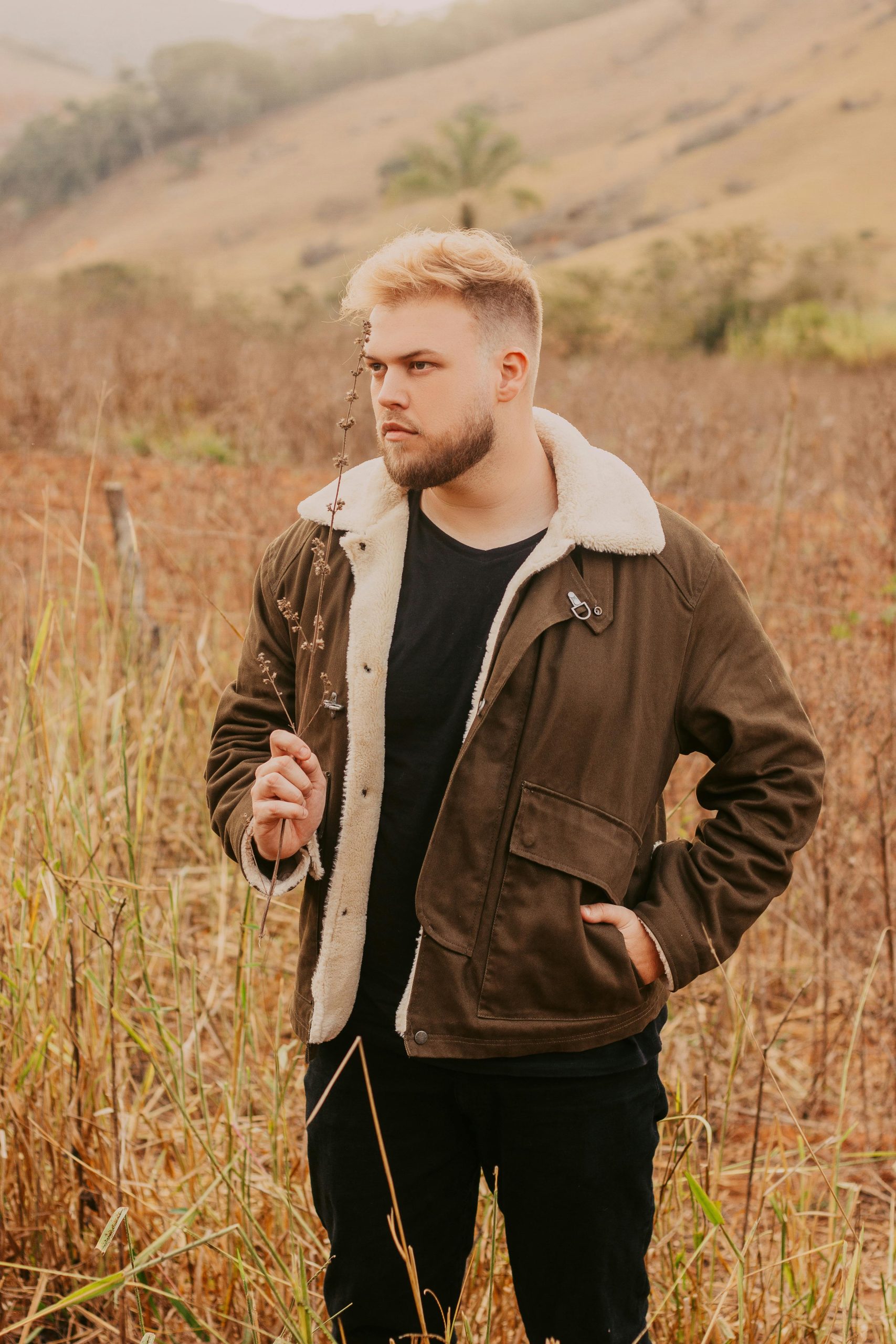 A man in casual clothing at a vineyard