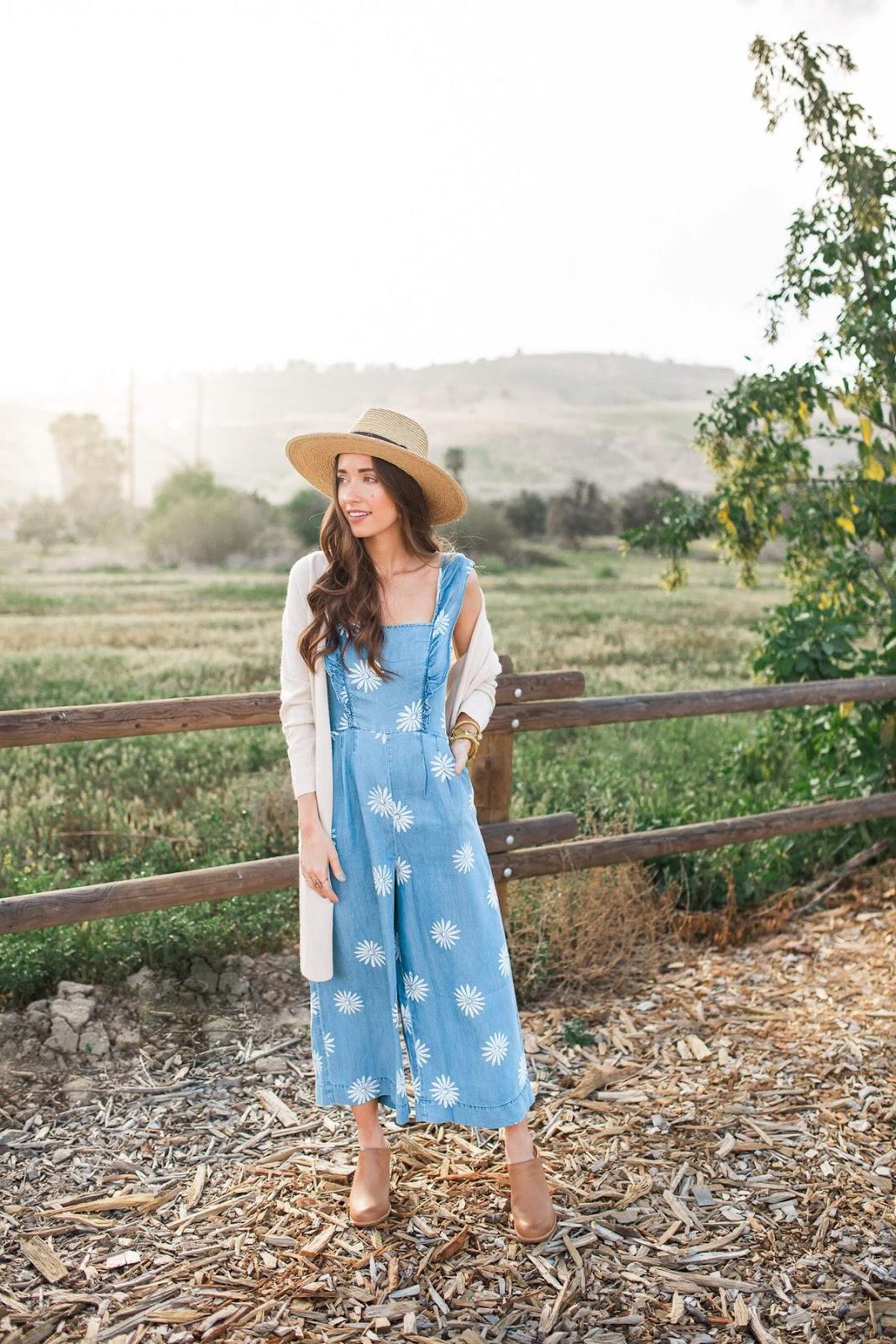 A women wearing a jumpsuit at a winery