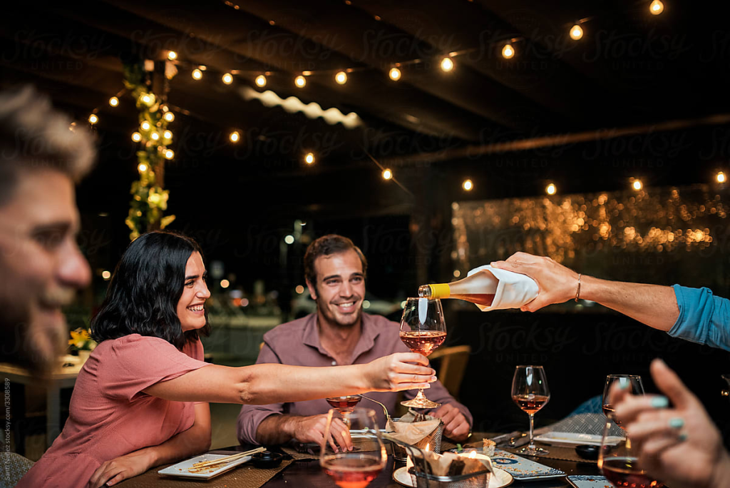 A group of friends at a wine bar