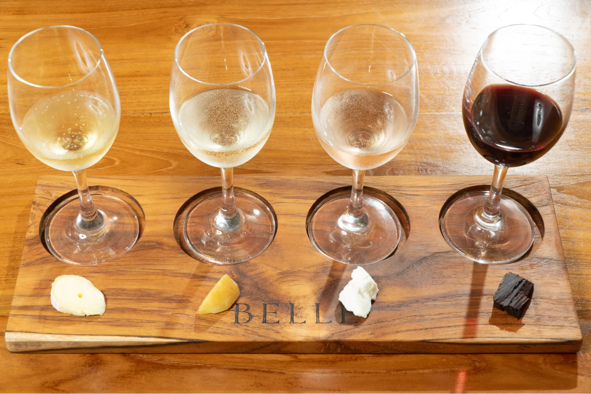A wine flight with pairings of cheese and chocolate from Belle Wine Bar in Ubud, Bali