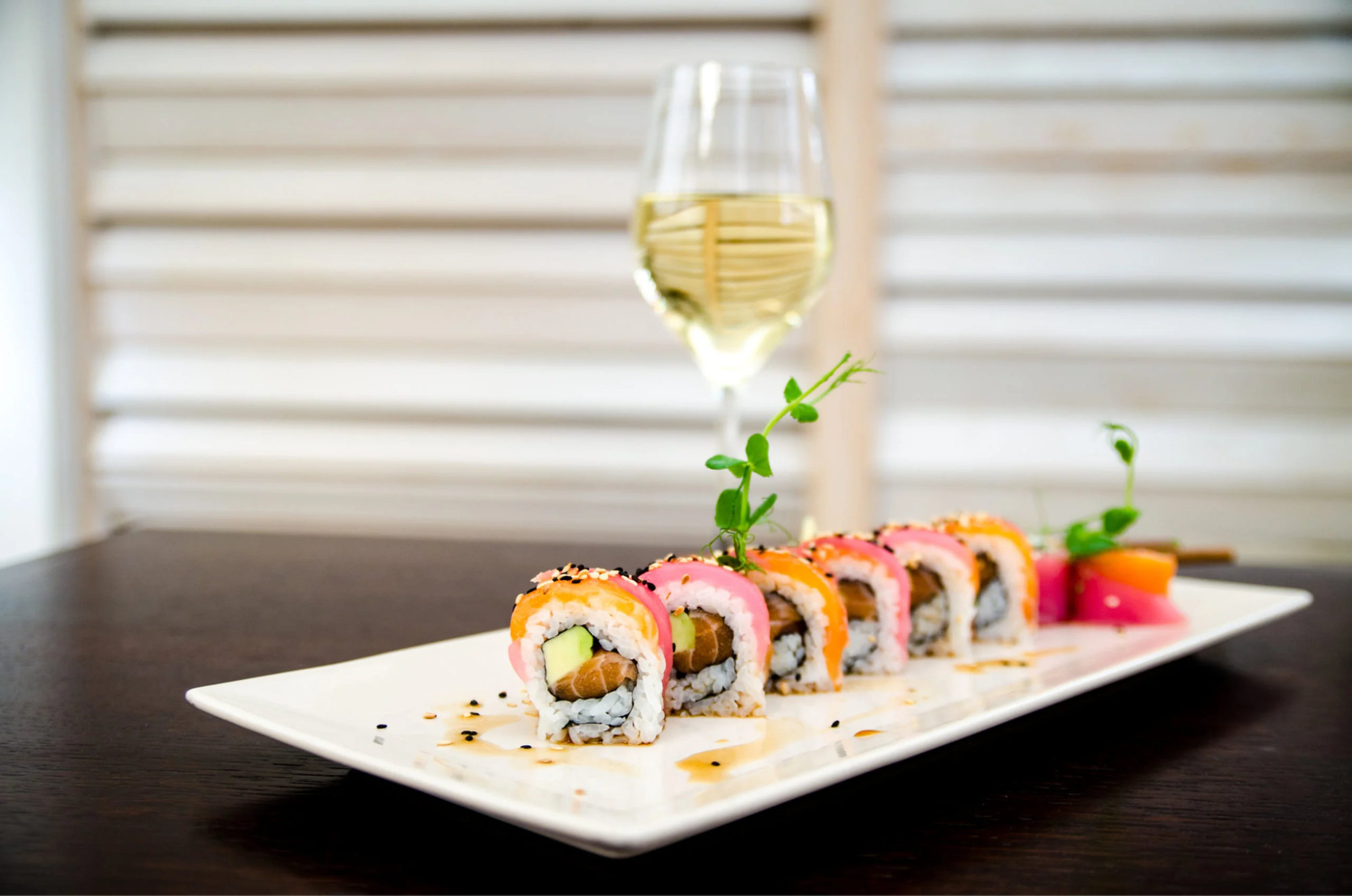 Sushi with a glass of white wine